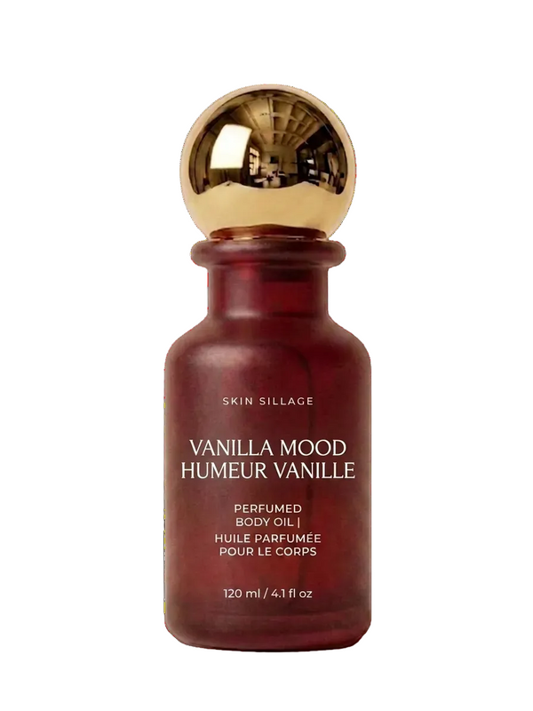 Red bottle of Skin Sillage Vanilla Mood perfume with gold cap on a white background